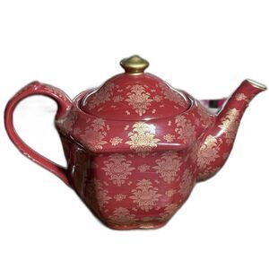 Dark garnet red and gold oriental tea pot glass or ceramic teapot for tea time